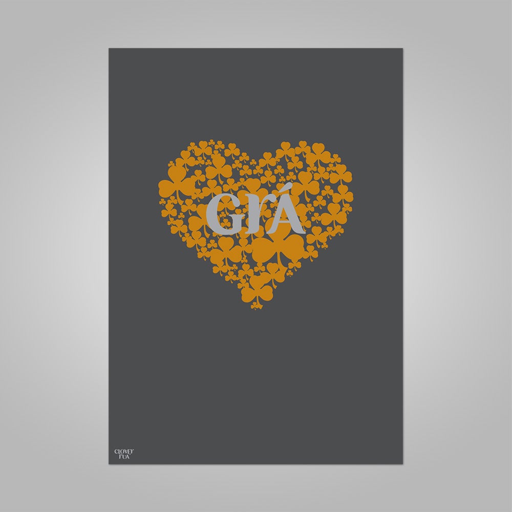 Grá (Irish for 'love') amber shamrock heart on graphite background, unframed print, A4 and A3; or A4 framed in black frame.